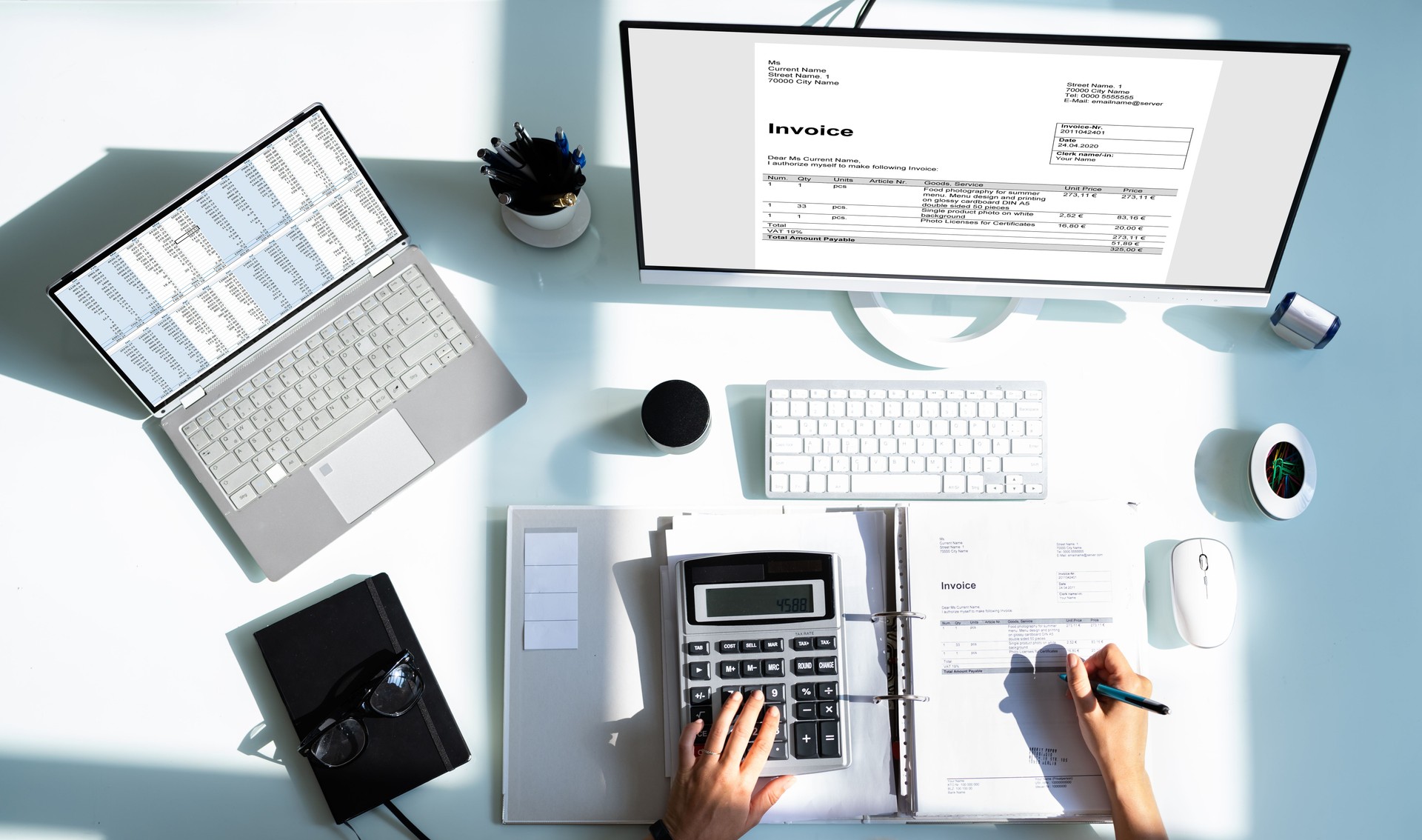 Accountant Using Calculator And Computer